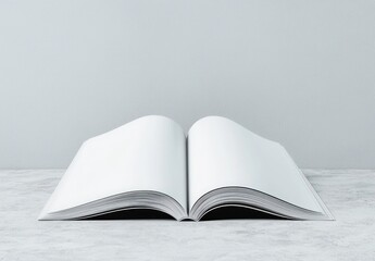 Open Blank Book on a Grey Tabletop