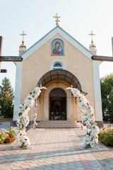 Wedding Arch at a Charming Church with Floral Decorations