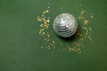 Christmas disco ball on a background of golden stars