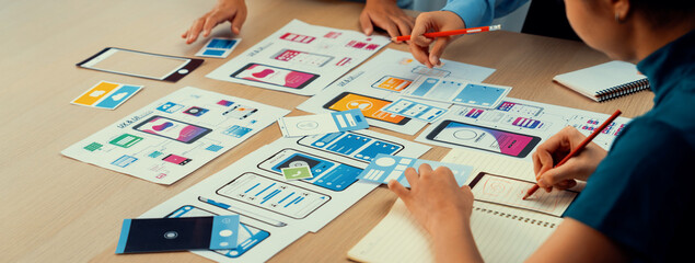 Panorama banner of startup company employee planning on user interface prototype for mobile...