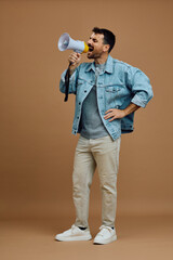 Fototapeta premium Studio shot of man shouting through megaphone.