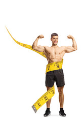 Shirtless sportsman with measuring tape flexing muscles