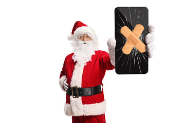Santa Claus holding a broken smartphone fixed with adhesive tape