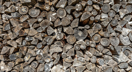 Chopped firewood in woodpile winter