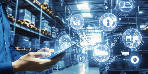 A person uses a tablet to oversee inventory management in a warehouse, surrounded by shelves filled with various products and digital icons