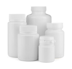 Many plastic medical bottles isolated on white