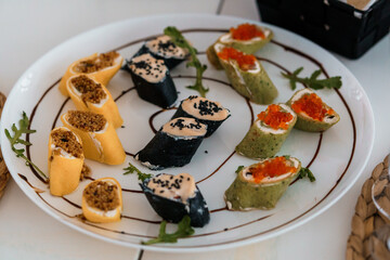 Exquisite Sushi Platter with Colorful Rolls and Toppings