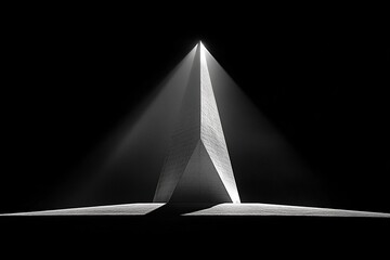 Black and white abstract architectural sculpture casting dramatic light and shadow in a dark space highlighting minimalist geometric forms and intense contrast