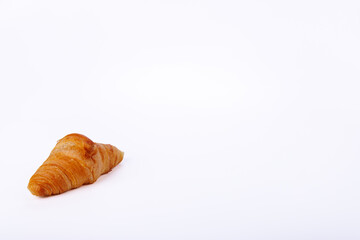 Delicious croissant on a seamless white background, capturing its warm golden color and airy layers, an enticing subject for food photography