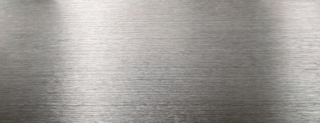 Metallic brushed surface texture with linear patterns for background. Panorama with copy space.