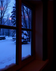 There is snow outside,window in winter.