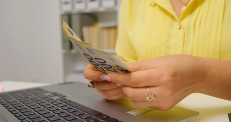 Money being counted then put on the desk. Savings account from financial income monthly.