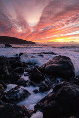 Winter sunset over the ocean at the Gauldrons Beach, Scotland