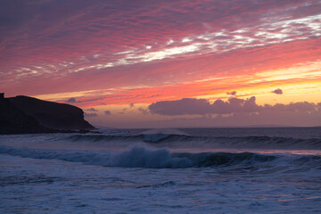 Winter sunset over the ocean at the Gauldrons Beach, Scotland