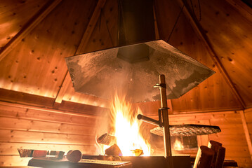 open fire inside a hut