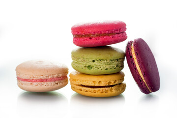 Colored macarons on a white background. Light and tasty dessert. traditional dessert