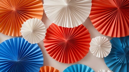Colorful Paper Fans Decoration on a White Background