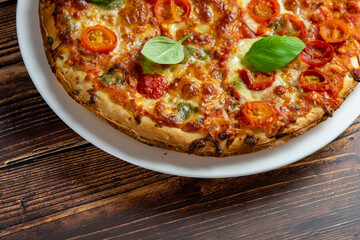 Vegetarian pizza on wooden background