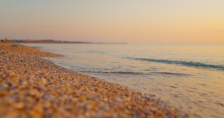 Travel destinations, enjoying holiday, Sea, vacantion seaside. Bright golden waves at sunset on the beach the black sea.