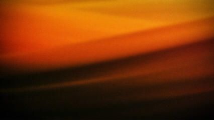 Abstract gradient in vibrant orange and yellow tones with a soft grainy texture, blending seamlessly for a warm, atmospheric background, perfect for digital use