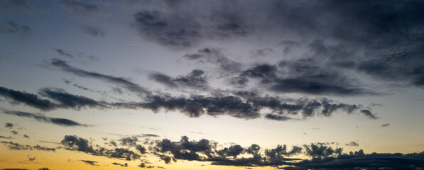 Obraz premium Clouds background. Dramatic Clouds Sunset Background. Sky with clouds in Sunrise. Sunrise with clouds in various shapes background. Calm Cloud.