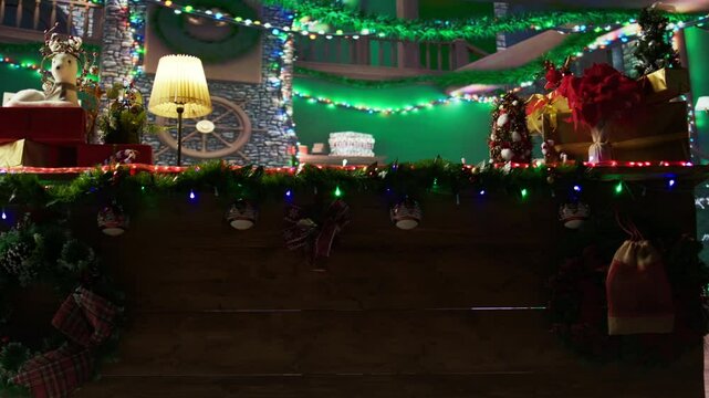 Festive North Pole log cabin where Santa and his helpers are making toys, empty colorful workshop with x mas decorations and garlands spreading the warmth of the holiday season.