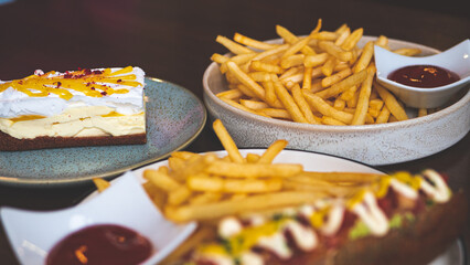 Restaurant meal aesthetic hot dog and chips french fries