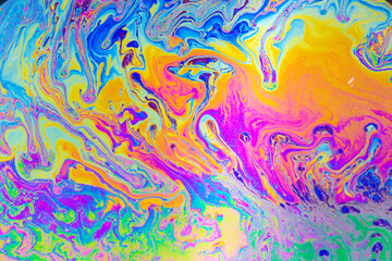 Fototapeta premium Psychedelic multicolored background abstract. Rainbow colors. patterns background. Photo macro shot of soap bubbles