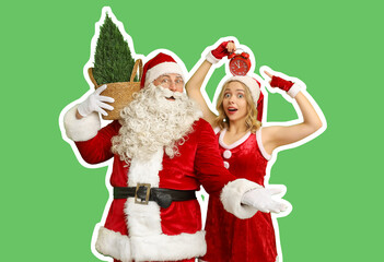 Surprised people dressed as Santa Claus with Cypress tree pointing at alarm clock on green background