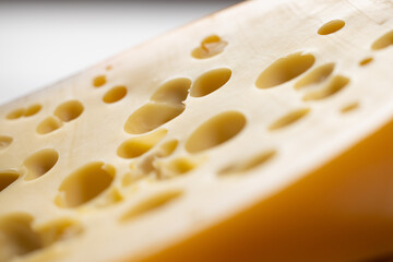 Emmental cheese with holes close-up