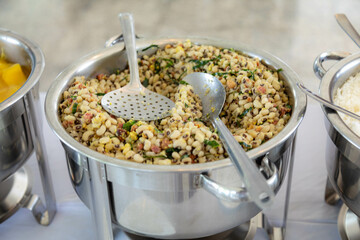 Traditional Brazilian system of serving food in a self-service buffet. Feijão tropeiro, cassava, barbecue, feijoada