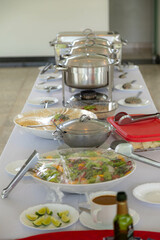 Traditional Brazilian system of serving food in a self-service buffet. Feijão tropeiro, cassava, barbecue, feijoada