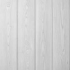 Fototapeta premium A close-up view of light-colored wooden planks arranged vertically.