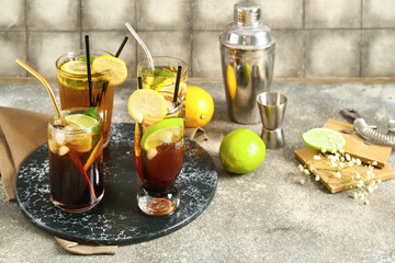 Glasses of cold Long Island iced tea on table