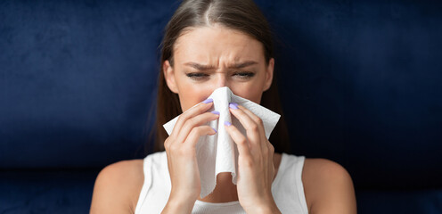 Sick Woman Blowing Nose In Paper Tissue Sitting In Bed During Coronavirus Pandemic Outbreak...