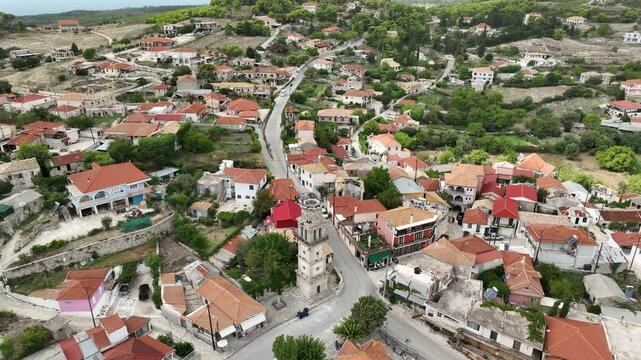 Flying over a town nestled between mountains on the Island of Zakynthos. Mavic 3