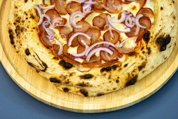 Traditional rustic artisanal pepperoni and onion pizza. Calabresa sausage pizza