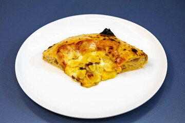 Traditional rustic pizza made with four cheeses, garlic and oil and pear with gorgonzola
