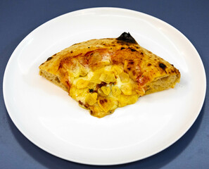 Traditional rustic pizza made with four cheeses, garlic and oil and pear with gorgonzola