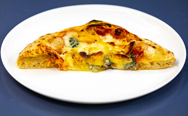 Traditional rustic pizza made with four cheeses, garlic and oil and pear with gorgonzola