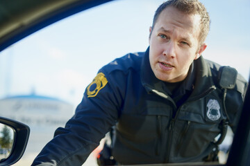 Traffic stop, police officer and talking at car for inspection, license check and law enforcement...