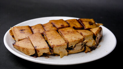 Sweet martabak terang bulan, chocolate peanut pancakes on a white plate