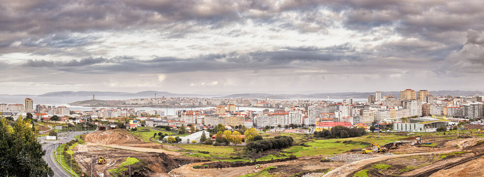 Panoramic view of the Galician city of A Coru&ntilde;a with Riazor beach and the Tower of Hercules on a cloudy day typical of northern Spain