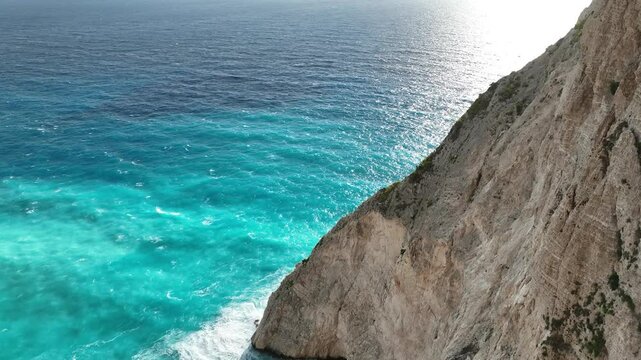 Flying over the beautiful blue waters of a beach on the island of Zakynthos. Mavic 3