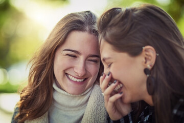 Face, gossip and smile of woman friends outdoor in nature together for bonding, humor or laughing....