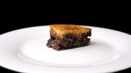 a slice of a sweet martabak or pancake with milk and melted chocolate in it