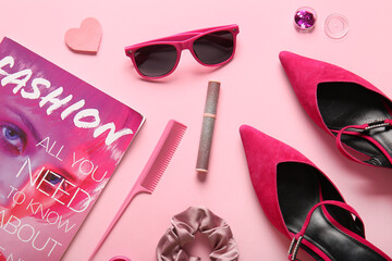 Composition with female accessories, cosmetics and magazine on pink background