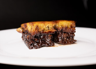 two pieces of sweet martabak or pancakes with milk and melted chocolate inside