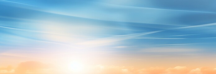 Obraz premium A serene sky with soft clouds and a warm glow at sunrise.