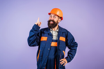 Portrait worker in construction helmet. Builder foreman or repairman in builder uniform. Worker in studio. Construction manager, builder in helmet. Male builder engineer.